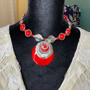 Choker necklace red and silver in color